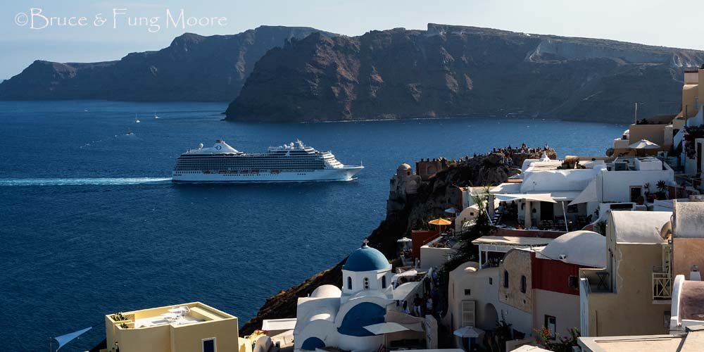 cruise ship passing oia castle
