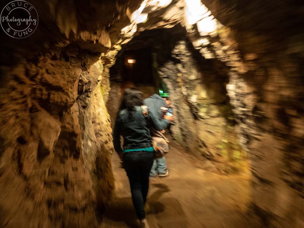 Following the tunnels in the Roquefort caves.
